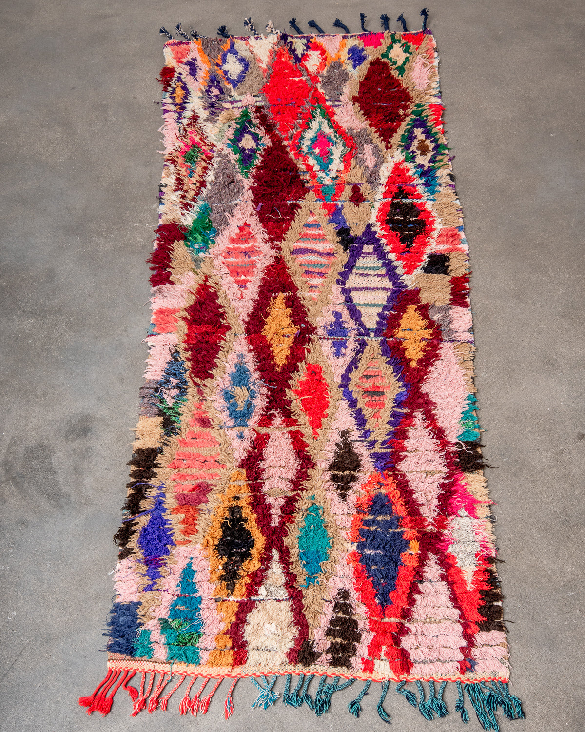 Modern designer vintage handcrafted Berber rug from Morocco. Boucherouite runner rug with beautiful colors and patterns.